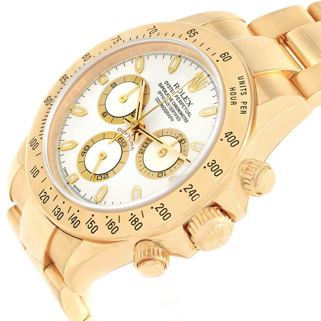 The image shows a side angle of the Rolex Daytona 116528 Men's Yellow Gold White Dial 116528 Men's Yellow Gold White Dial watch, highlighting the face, bezel, pushers, crown, and bracelet.