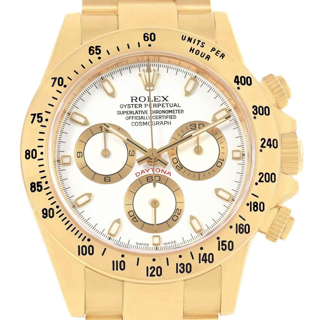 The image shows a close-up of the Rolex Daytona 116528 Men's Yellow Gold White Dial 116528 Men's Yellow Gold White Dial watch face and bezel, highlighting its gold detailing and chronograph sub-dials.