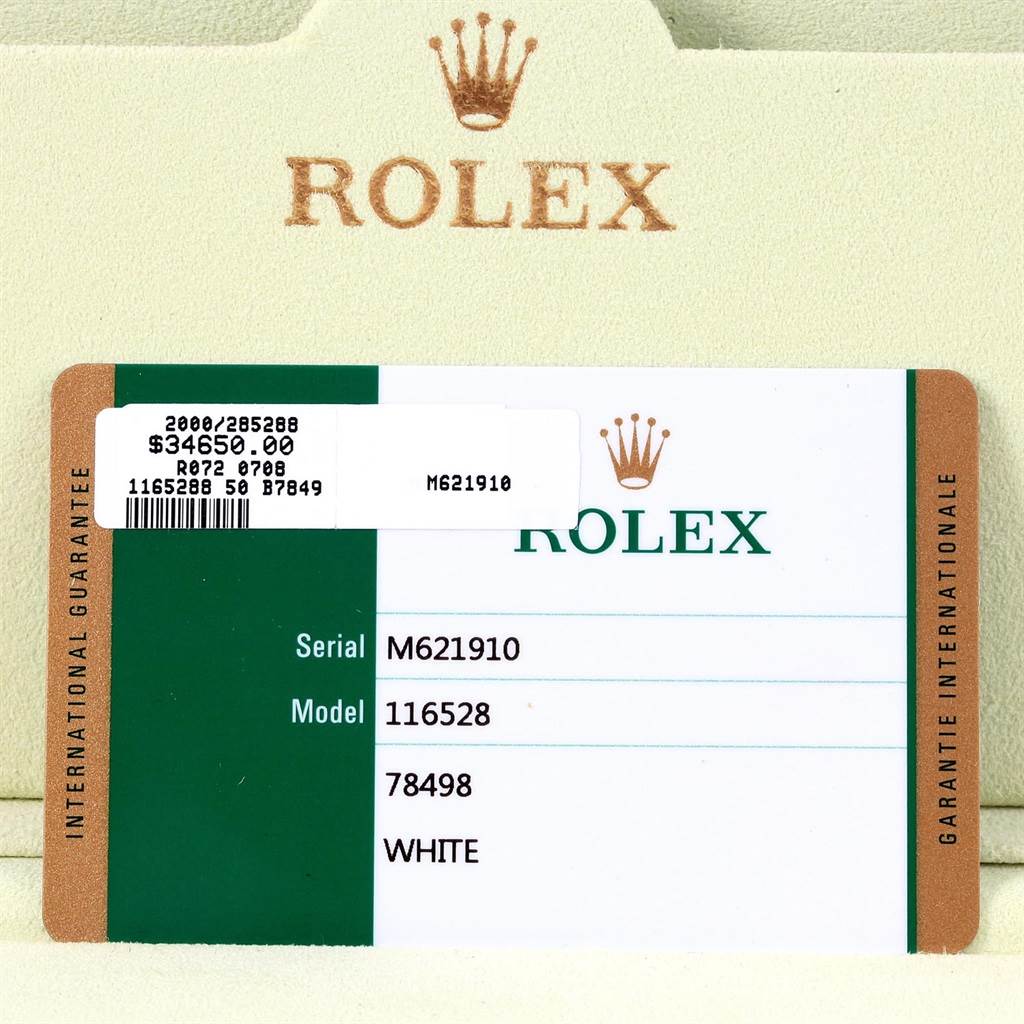 The image shows the warranty card for a Rolex Daytona 116528 Men's Yellow Gold White Dial 116528 Men's Yellow Gold White Dial model.