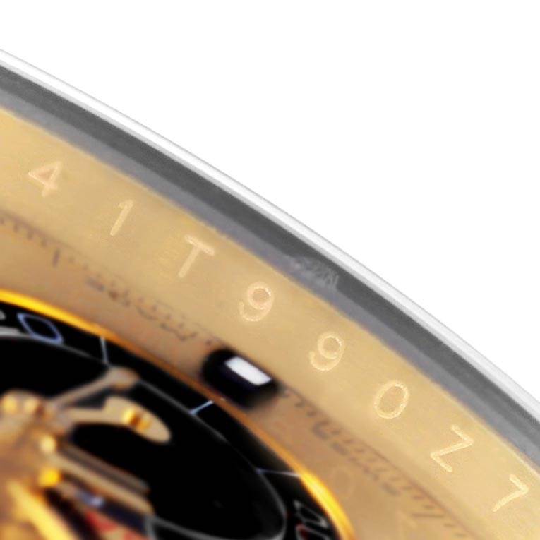 This image shows a close-up of the bezel and part of the dial of a Rolex Daytona 116518 Men's Yellow Gold Champagne Dial 116518 Men's Yellow Gold Champagne Dial watch at an oblique angle.