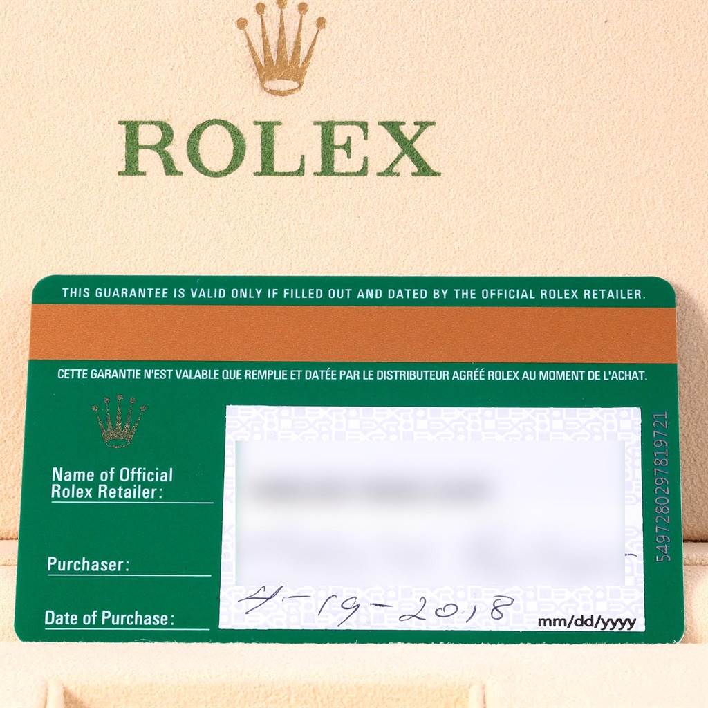 This image shows a warranty card for a Rolex Daytona 116518 Men's Yellow Gold Champagne Dial 116518 Men's Yellow Gold Champagne Dial watch, taken from a top-down angle.