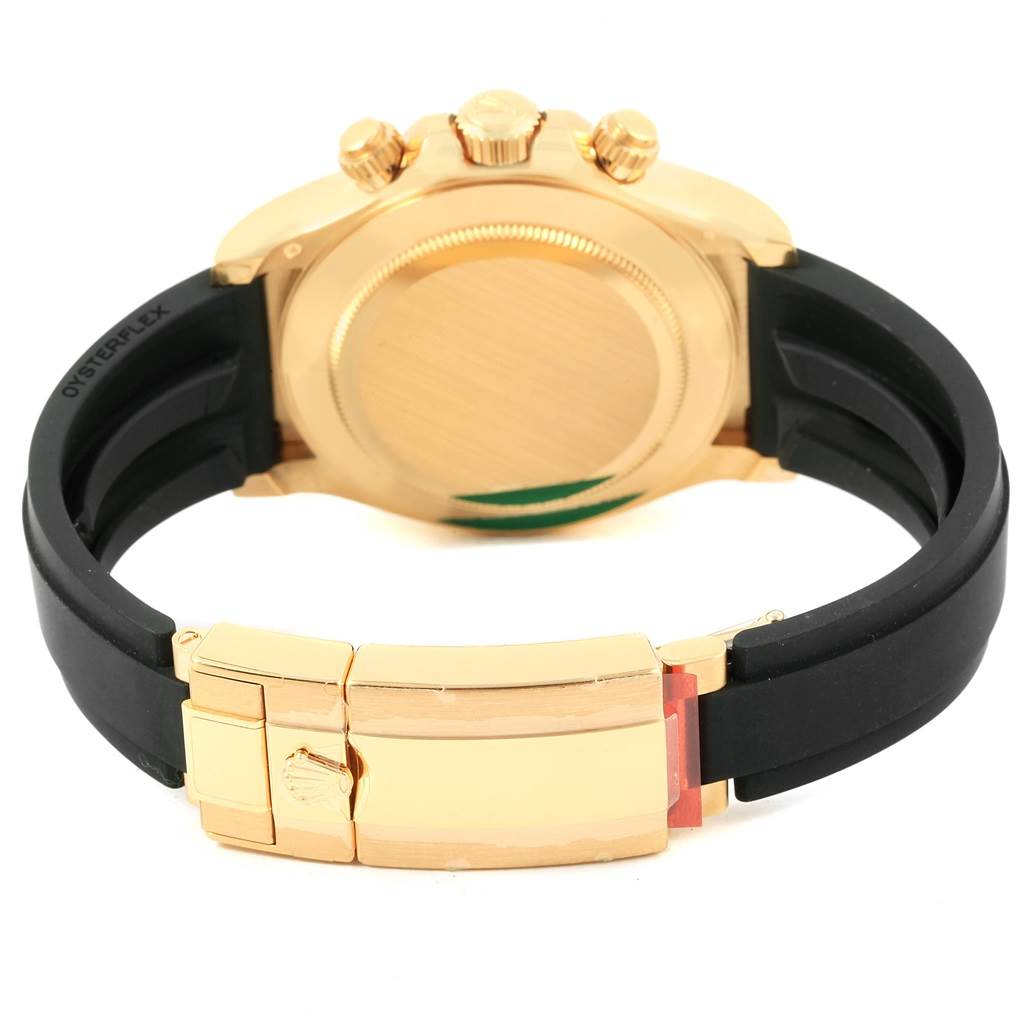 This image shows the back view of a Rolex Daytona 116518 Men's Yellow Gold Champagne Dial 116518 Men's Yellow Gold Champagne Dial watch, displaying the case, crown, pushers, and black strap with a clasp.