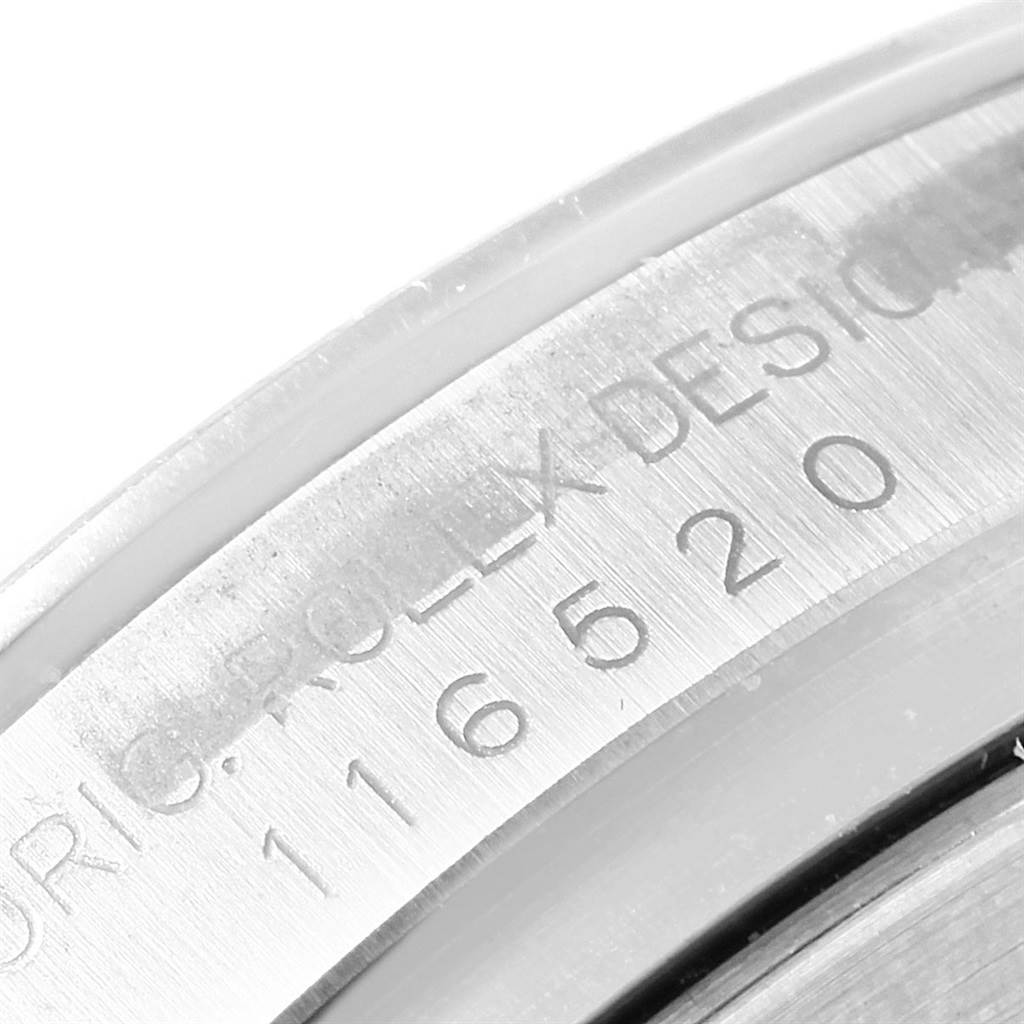 This image shows a close-up of the engraved serial number on the case back of a Rolex Daytona 116520 Men's Stainless Steel Black Dial 116520 Men's Stainless Steel Black Dial watch.