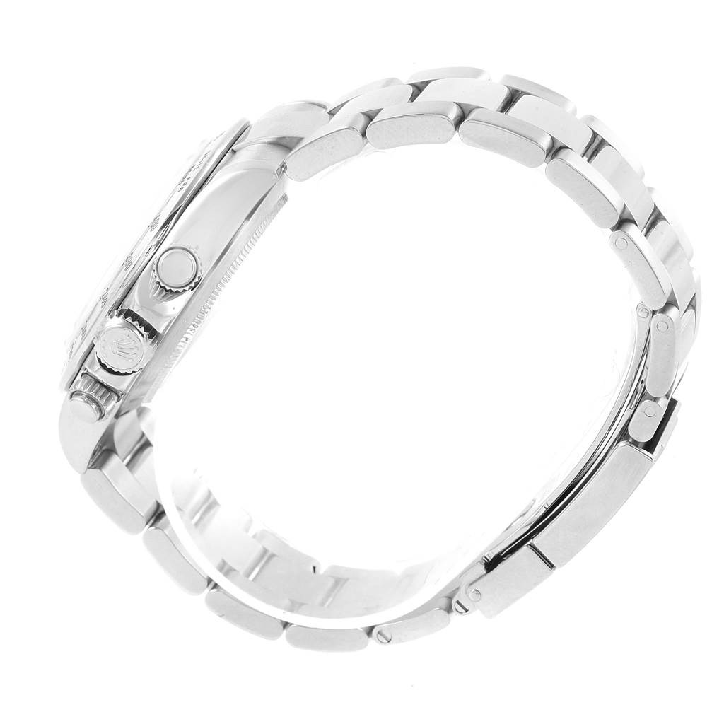 This image shows a side view of the case and bracelet of a Rolex Daytona 116520 Men's Stainless Steel White Dial 116520 Men's Stainless Steel White Dial watch, focusing on the crown and pushers.