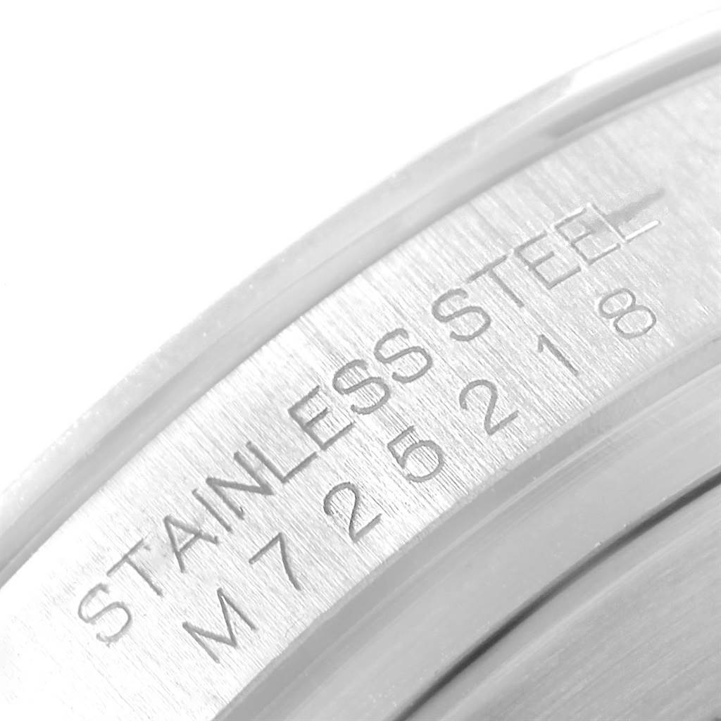 This close-up image of a Rolex Daytona 116520 Men's Stainless Steel White Dial 116520 Men's Stainless Steel White Dial watch shows the engraved stainless steel case back.