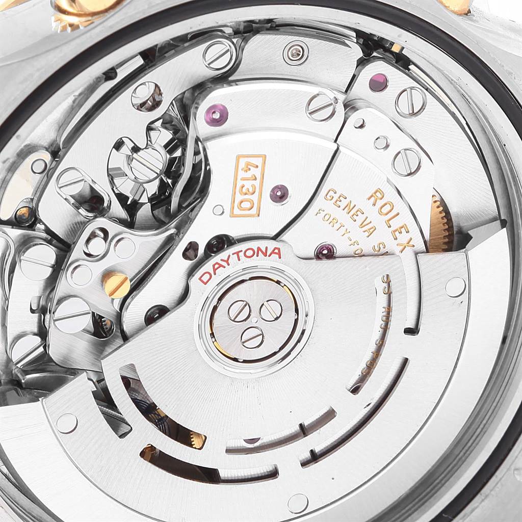 This close-up image shows the intricate inner movement of a Rolex Daytona 116503 Men's Steel and Gold (two tone) White Dial 116503 Men's Steel and Gold (two tone) White Dial watch.