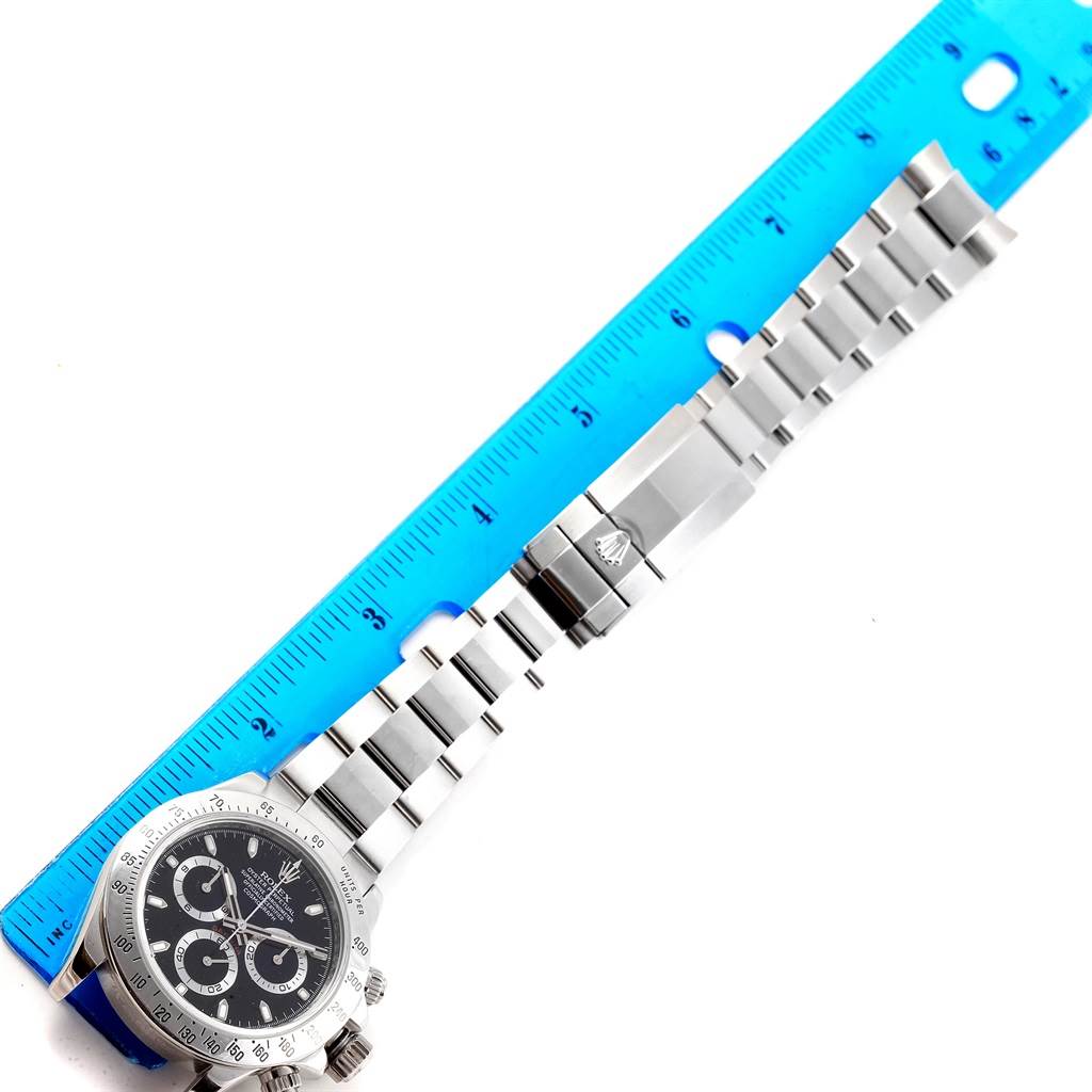 This image shows a top-down view of a Rolex Daytona 116520 Men's Stainless Steel Black Dial 116520 Men's Stainless Steel Black Dial watch, focusing on its bracelet, clasp, and a small portion of the dial.