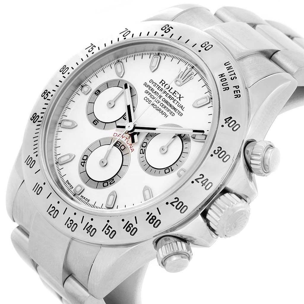 The Rolex Daytona 116520 Men
s Stainless Steel White Dial 116520 Men
s Stainless Steel White Dial watch is shown at an oblique angle displaying the face, bezel, crown, and pushers.