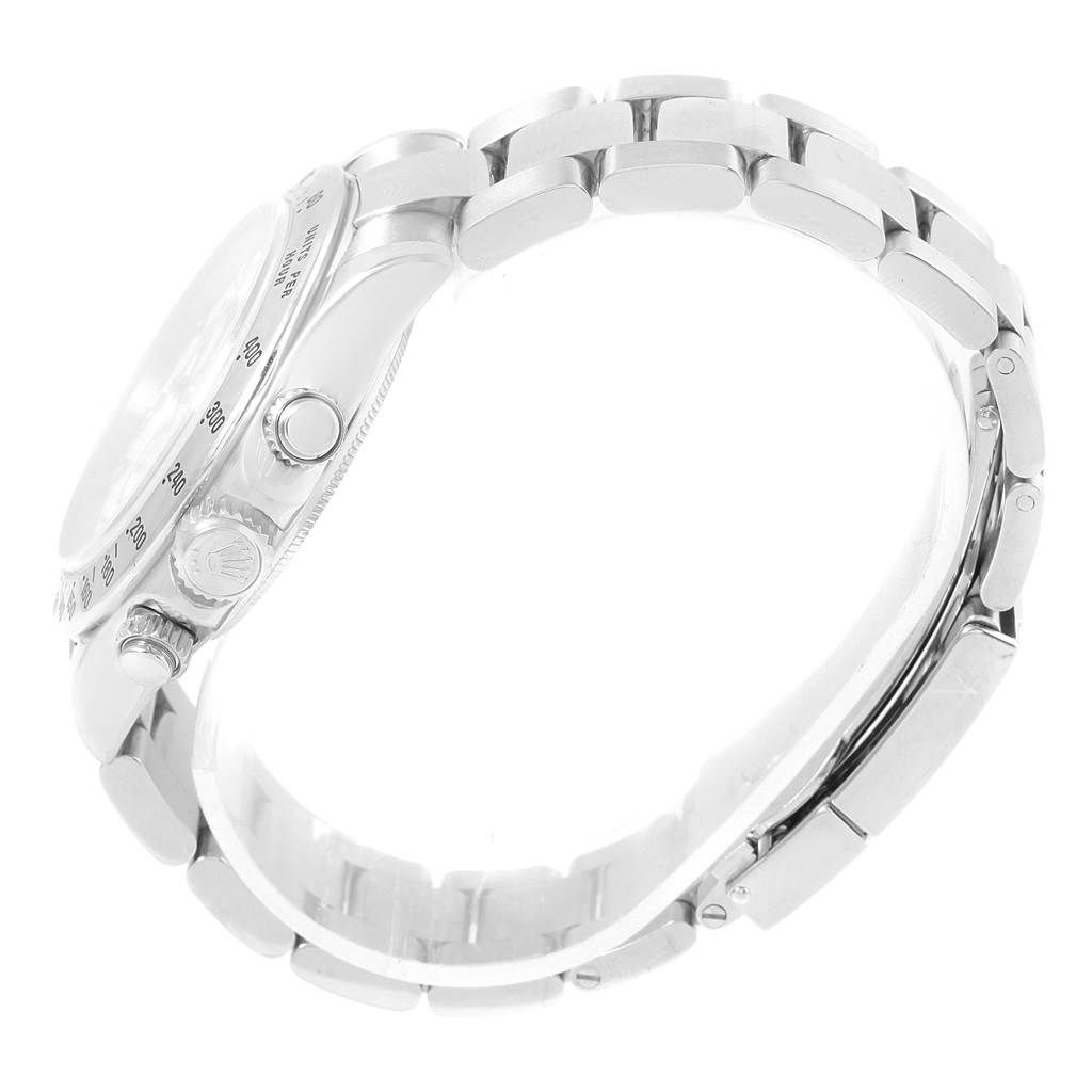 The image shows a side view of the Rolex Daytona 116520 Men
s Stainless Steel White Dial 116520 Men
s Stainless Steel White Dial watch, highlighting the bracelet, crown, and pushers.