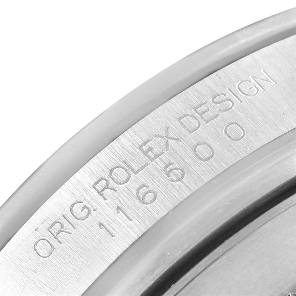This image shows a close-up of the engraved serial number "116500" and "ORIG. ROLEX DESIGN" inside the case of a Rolex Daytona 116500 Men's Stainless Steel Black Dial 116500 Men's Stainless Steel Black Dial watch.