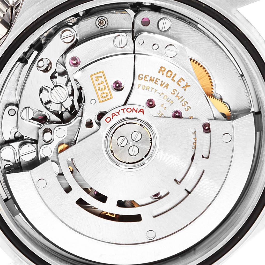 The image shows the internal movement mechanism of a Rolex Daytona 116520 Men's Stainless Steel White Dial 116520 Men's Stainless Steel White Dial watch, including gears, rotors, and markings.