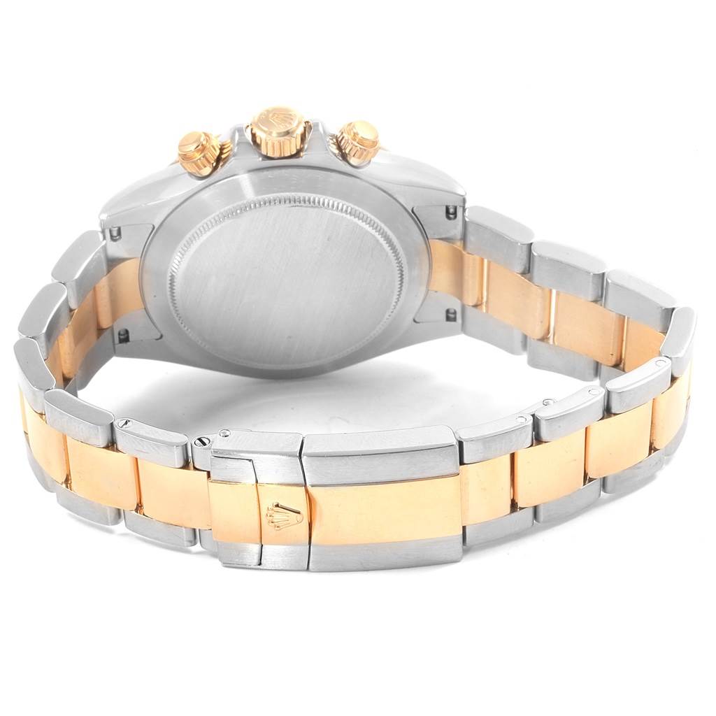 The image shows the back casing, crown, and bracelet of a Rolex Daytona 116523 Men's Steel and Gold (two tone) Mother of Pearl Dial 116523 Men's Steel and Gold (two tone) Mother of Pearl Dial watch, captured from the rear angle.