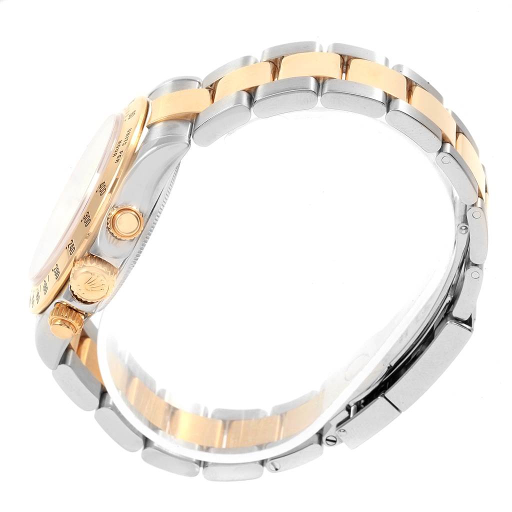 Side view of the Rolex Daytona 116523 Men's Steel and Gold (two tone) Mother of Pearl Dial 116523 Men's Steel and Gold (two tone) Mother of Pearl Dial watch, showing the crown, pushers, and two-tone bracelet.