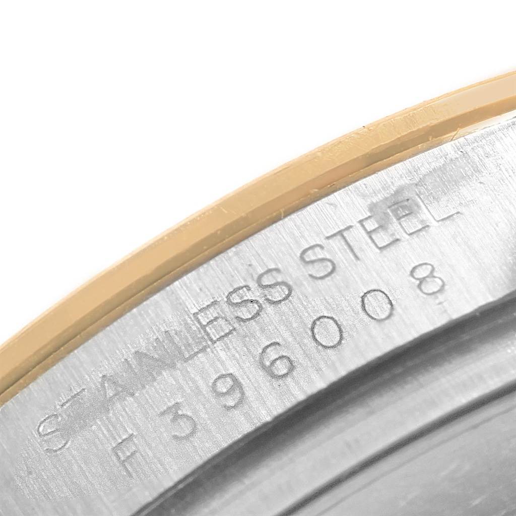 This image shows a close-up of the stainless steel case back engraving on a Rolex Daytona 116523 Men's Steel and Gold (two tone) Mother of Pearl Dial 116523 Men's Steel and Gold (two tone) Mother of Pearl Dial watch.