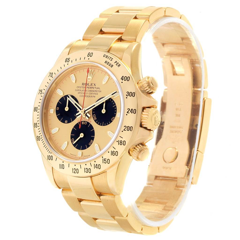 The Rolex Daytona 116528 Men's Yellow Gold Champagne Dial 116528 Men's Yellow Gold Champagne Dial watch is shown from a slight angle, highlighting the gold bracelet, bezel, and three sub-dials on the face.