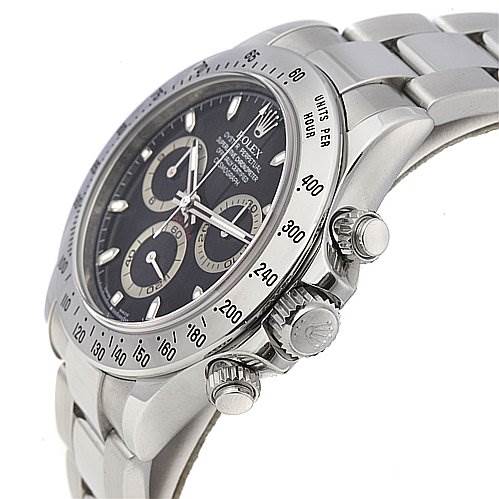 The image shows a close-up side angle of a Rolex Daytona 116520 Men's Stainless Steel Black Dial 116520 Men's Stainless Steel Black Dial watch, featuring its bezel, crown, pushers, and part of the metal bracelet.