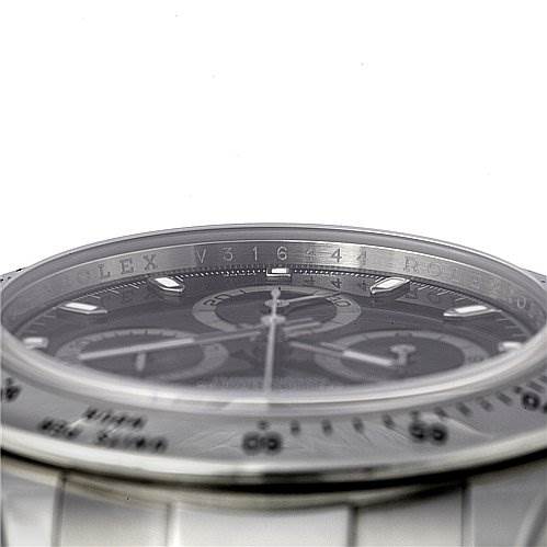The image shows an angled close-up of the Rolex Daytona 116520 Men's Stainless Steel Black Dial 116520 Men's Stainless Steel Black Dial watch, highlighting its bezel and chronograph sub-dials.