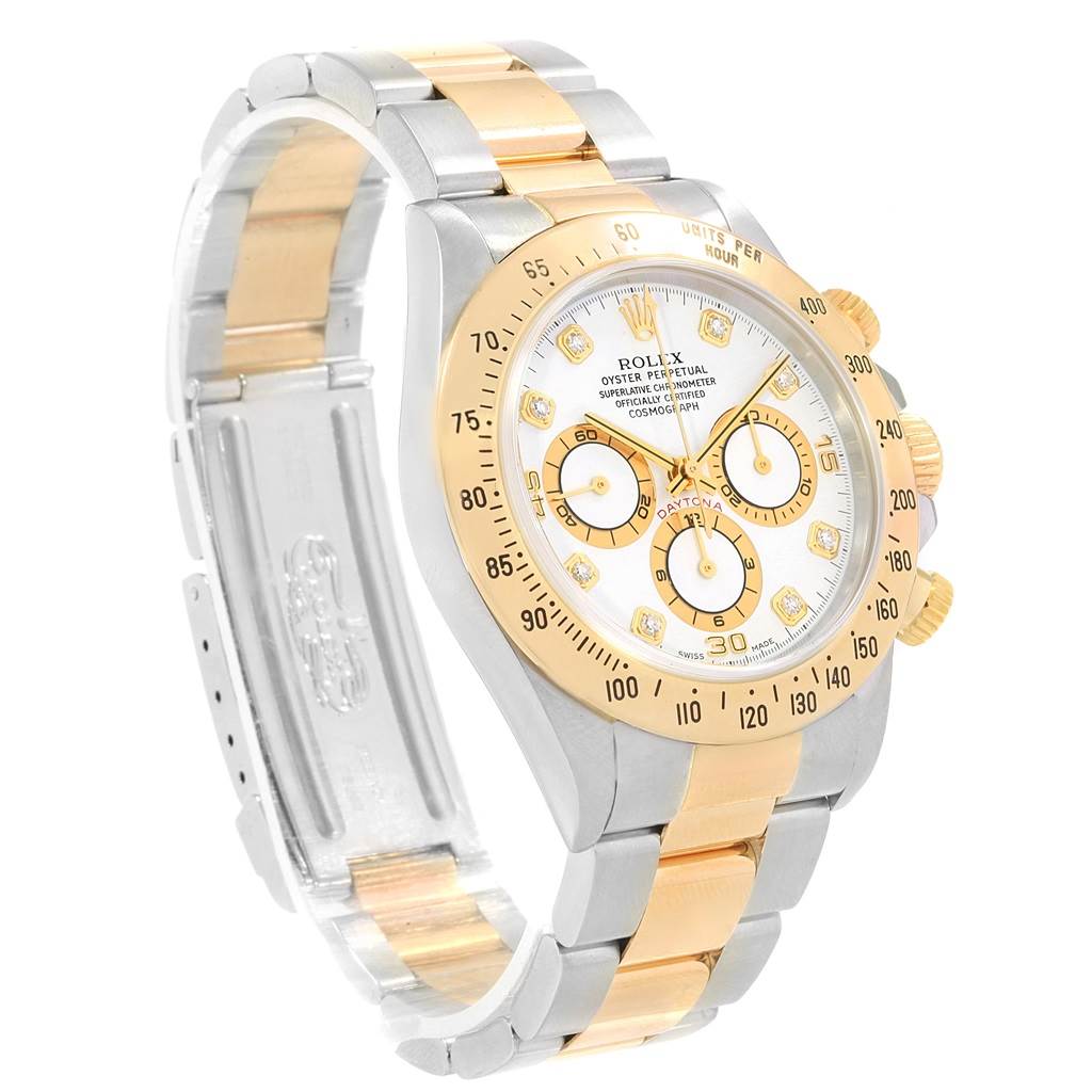 The image shows a Rolex Daytona 16523 Men's Steel and Gold (two tone) White Dial 16523 Men's Steel and Gold (two tone) White Dial watch at a three-quarter angle, highlighting its bezel, bracelet, and dial.