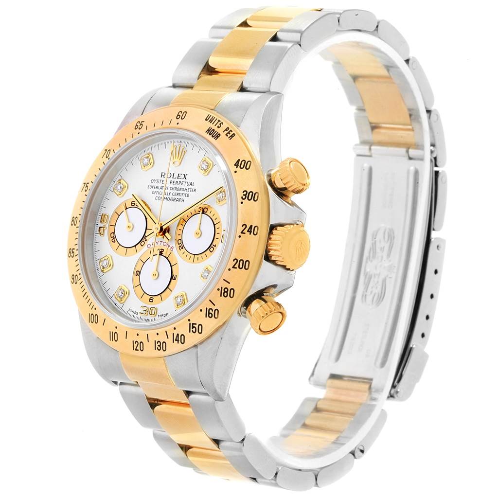 The Rolex Daytona 16523 Men's Steel and Gold (two tone) White Dial 16523 Men's Steel and Gold (two tone) White Dial watch is shown at an angle revealing the face, bezel, crown, pushers, and part of the bracelet with a clasp.
