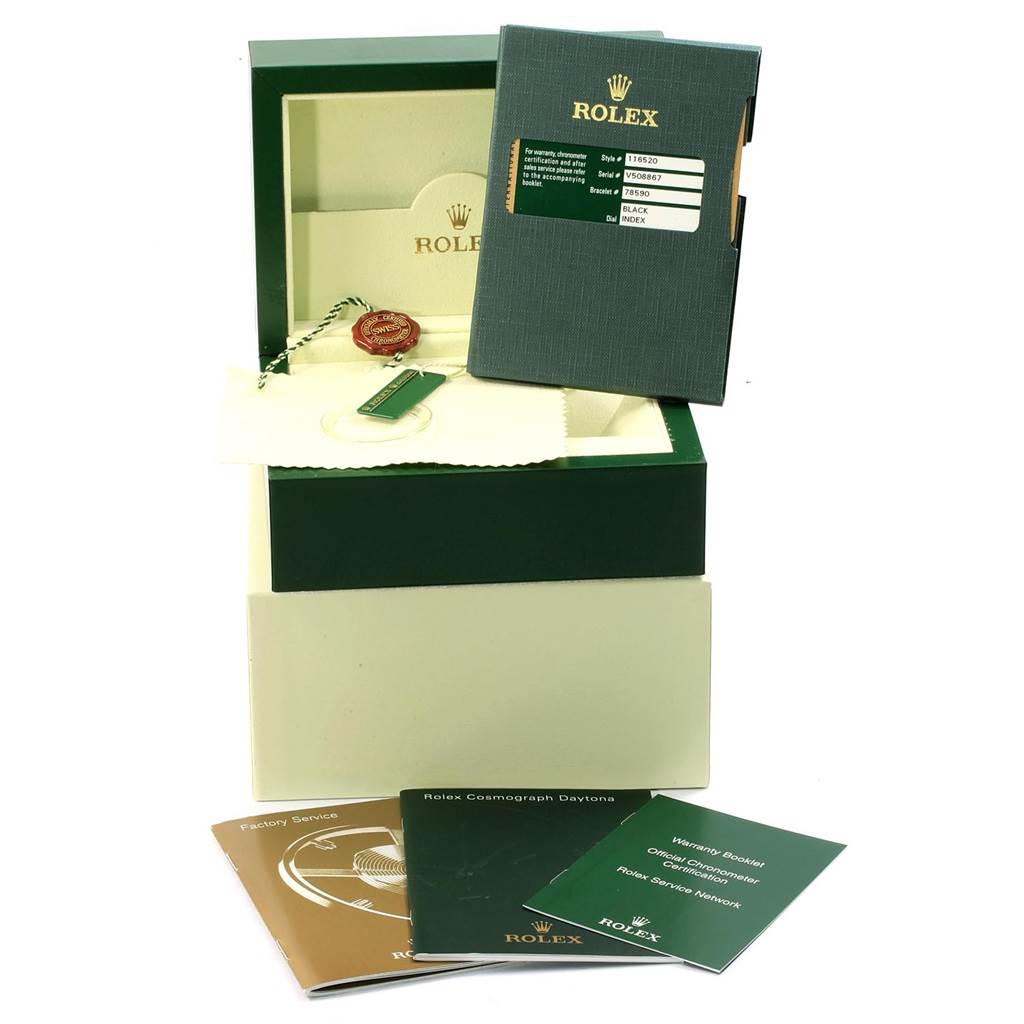 The image shows an open Rolex box for the Daytona model watch, including the warranty card, booklets, tags, and polishing cloth.