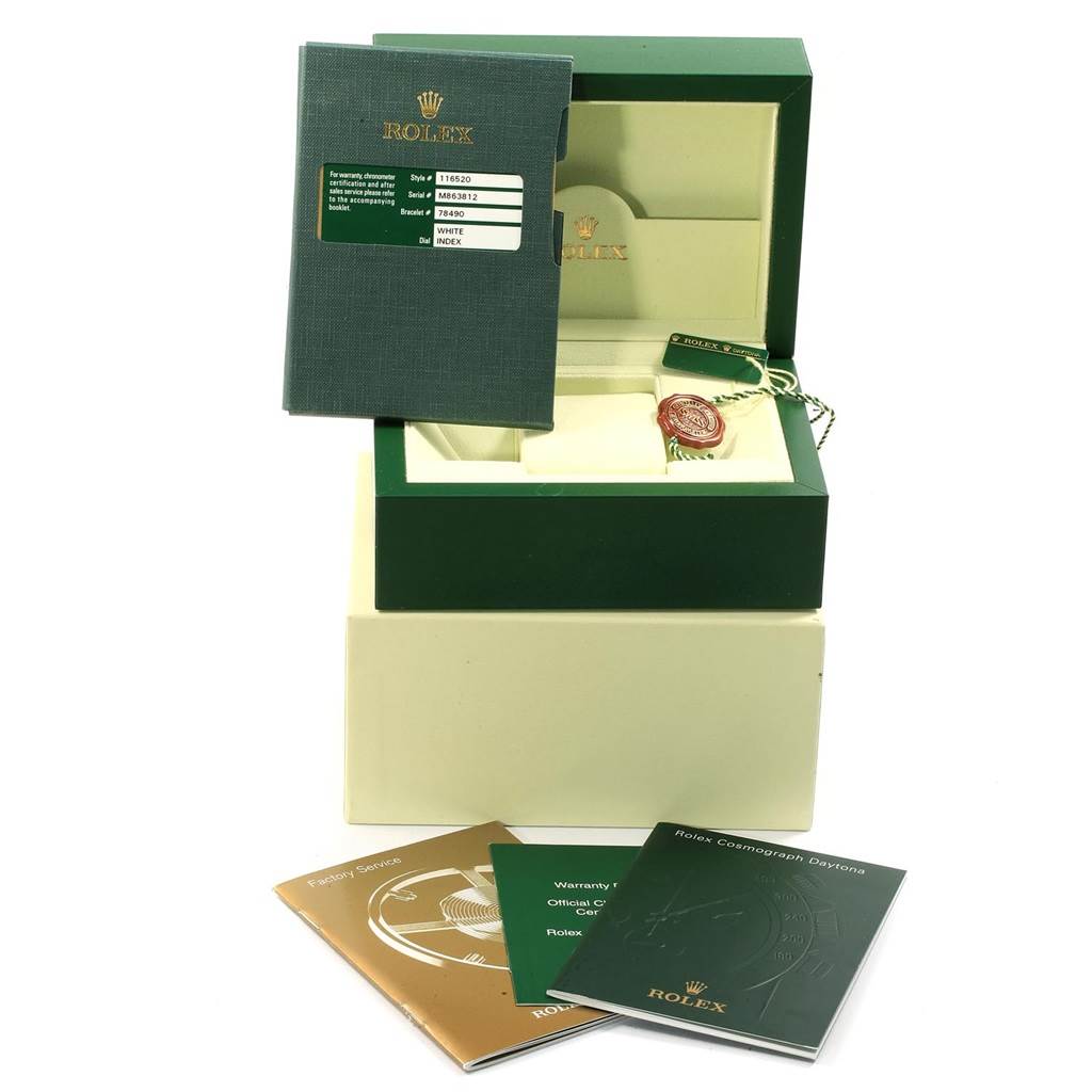 The image shows the packaging and accessories of the Rolex Daytona 116520 Men's Stainless Steel White Dial 116520 Men's Stainless Steel White Dial watch, including the box, manuals, and tags.