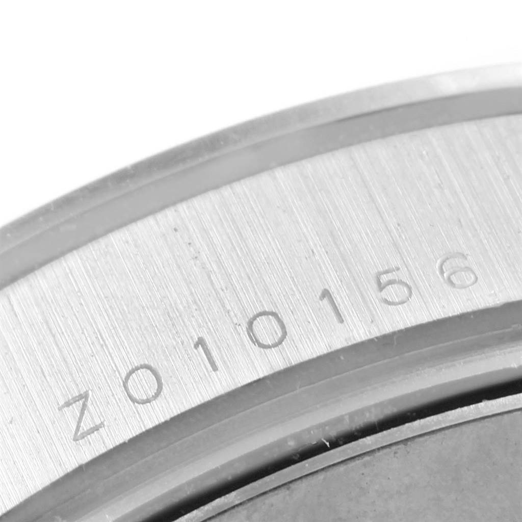 Close-up of the serial number engraved on the case of a Rolex Daytona 116509 Men's White Gold Silver Dial 116509 Men's White Gold Silver Dial watch.