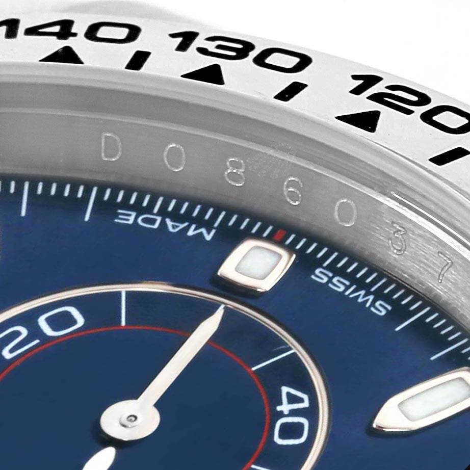 The image shows a close-up angled view of the dial and bezel of a Rolex Daytona 116509 Men's White Gold Blue Dial 116509 Men's White Gold Blue Dial watch.