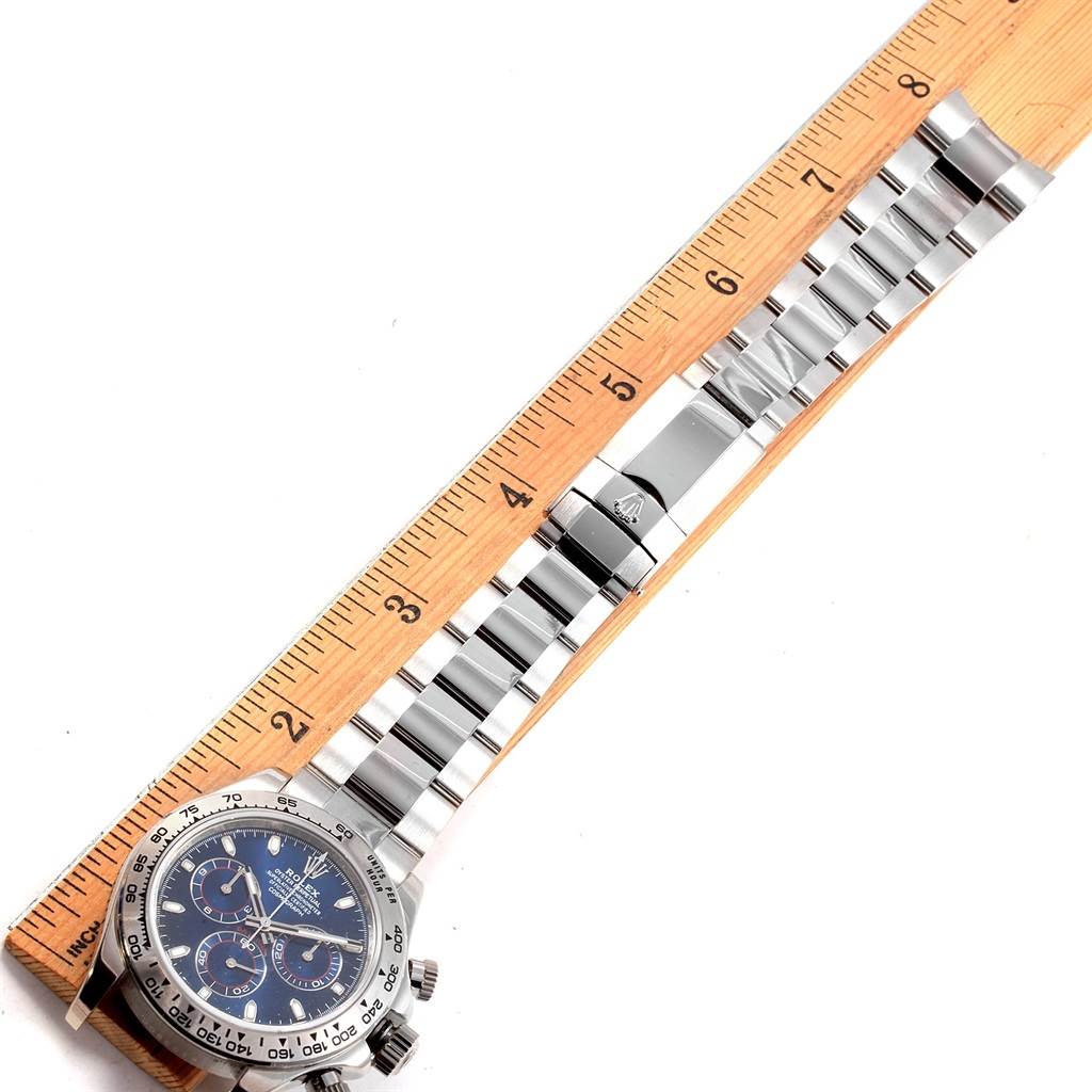 This image shows a Rolex Daytona 116509 Men's White Gold Blue Dial 116509 Men's White Gold Blue Dial watch with a ruler, revealing the face, dial, and full metal bracelet.