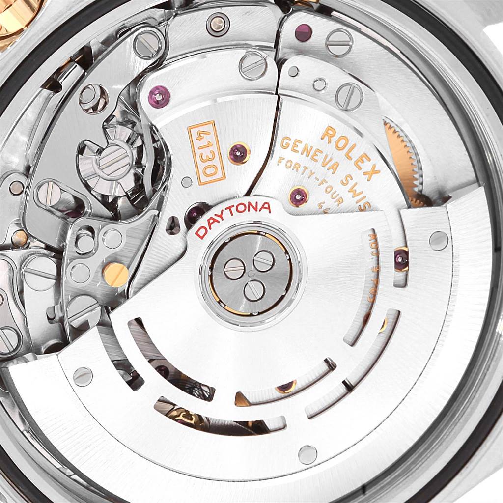 This is a close-up shot of the movement mechanism of a Rolex Daytona 116523 Men's Steel and Gold (two tone) Grey Dial 116523 Men's Steel and Gold (two tone) Grey Dial watch, showcasing the intricate internal components.