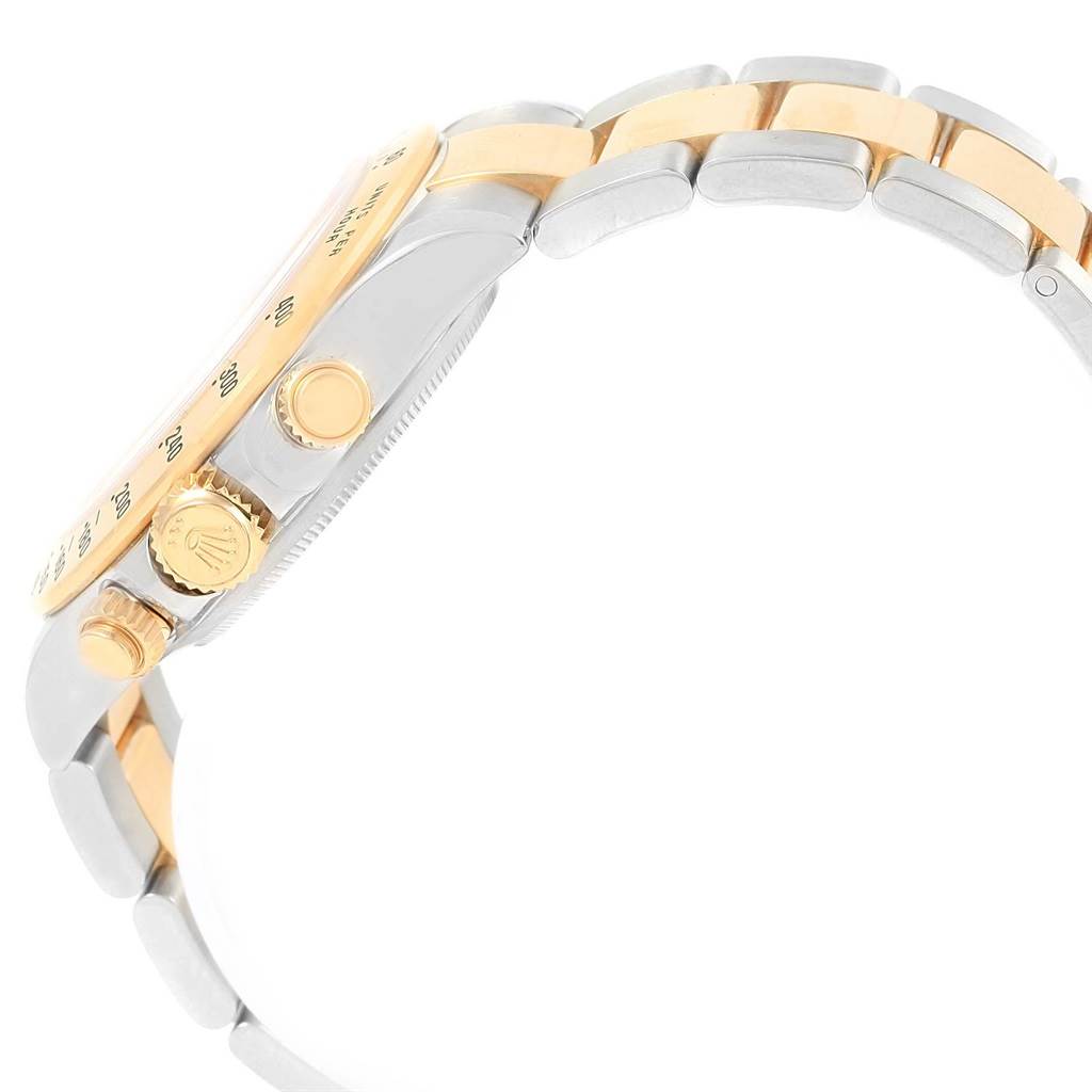 The image shows a side view of a Rolex Daytona 116523 Men's Steel and Gold (two tone) Grey Dial 116523 Men's Steel and Gold (two tone) Grey Dial watch, highlighting its crown, pushers, and two-tone bracelet.