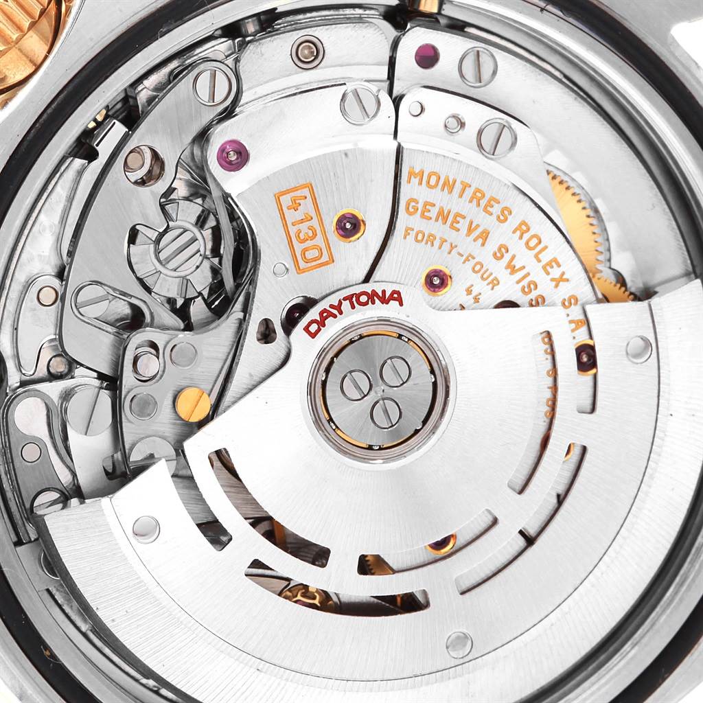 This close-up image shows the movement mechanism and rotor of a Rolex Daytona 116523 Men's Steel and Gold (two tone) Grey Dial 116523 Men's Steel and Gold (two tone) Grey Dial watch.