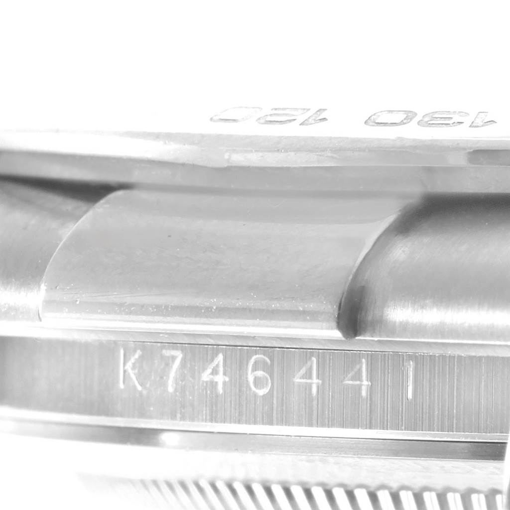 The image shows a close-up of the serial number engraved on the side of the Rolex Daytona 116519 Men's White Gold White Dial 116519 Men's White Gold White Dial watch.