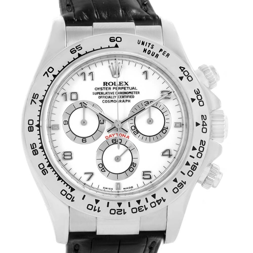 The image shows a front view of a Rolex Daytona 116519 Men's White Gold White Dial 116519 Men's White Gold White Dial watch with a leather strap, clear dial, and visible chronograph functions.