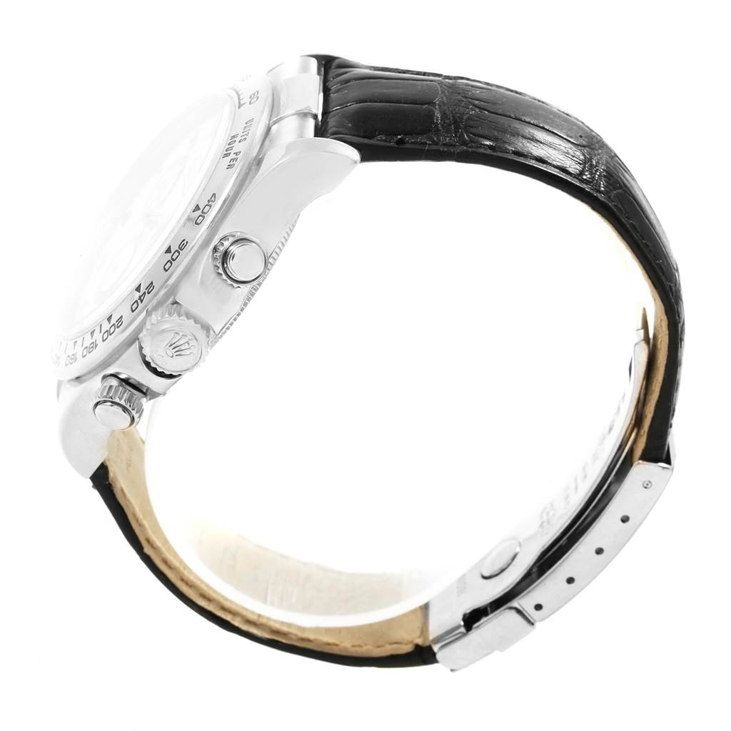 This image shows a side view of a Rolex Daytona 116519 Men's White Gold White Dial 116519 Men's White Gold White Dial watch, highlighting the crown, pushers, and a leather strap.