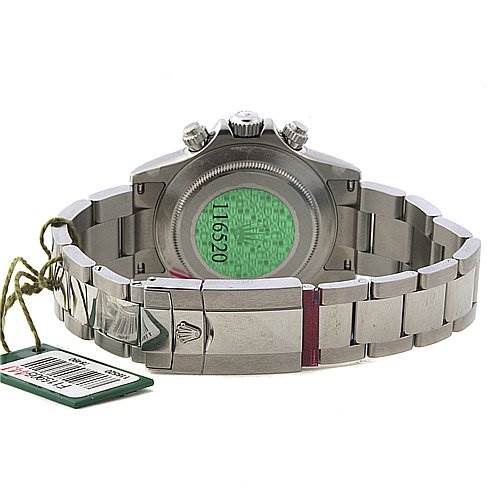 This image shows the back view of a Rolex Daytona 116520 Men's Stainless Steel Black Dial 116520 Men's Stainless Steel Black Dial watch, highlighting its case back, bracelet, and a tag attached.