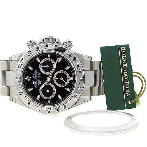 The Rolex Daytona 116520 Men's Stainless Steel Black Dial 116520 Men's Stainless Steel Black Dial watch is shown from the front, displaying the dial, bezel, bracelet, and a green tag.