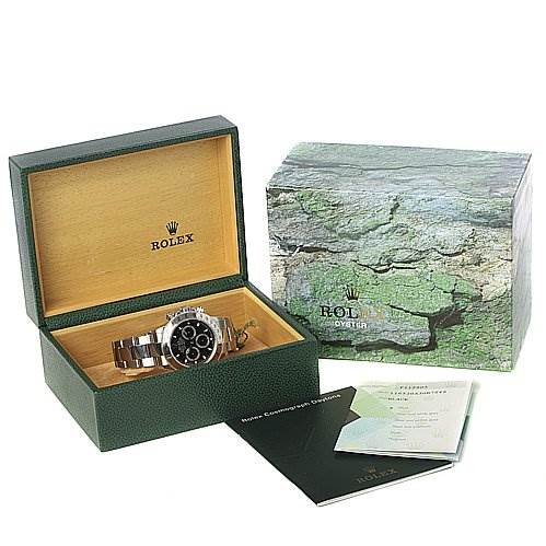 The image shows a Rolex Daytona 116520 Men's Stainless Steel Black Dial 116520 Men's Stainless Steel Black Dial watch in an open green box, with the outer packaging and documentation displayed.