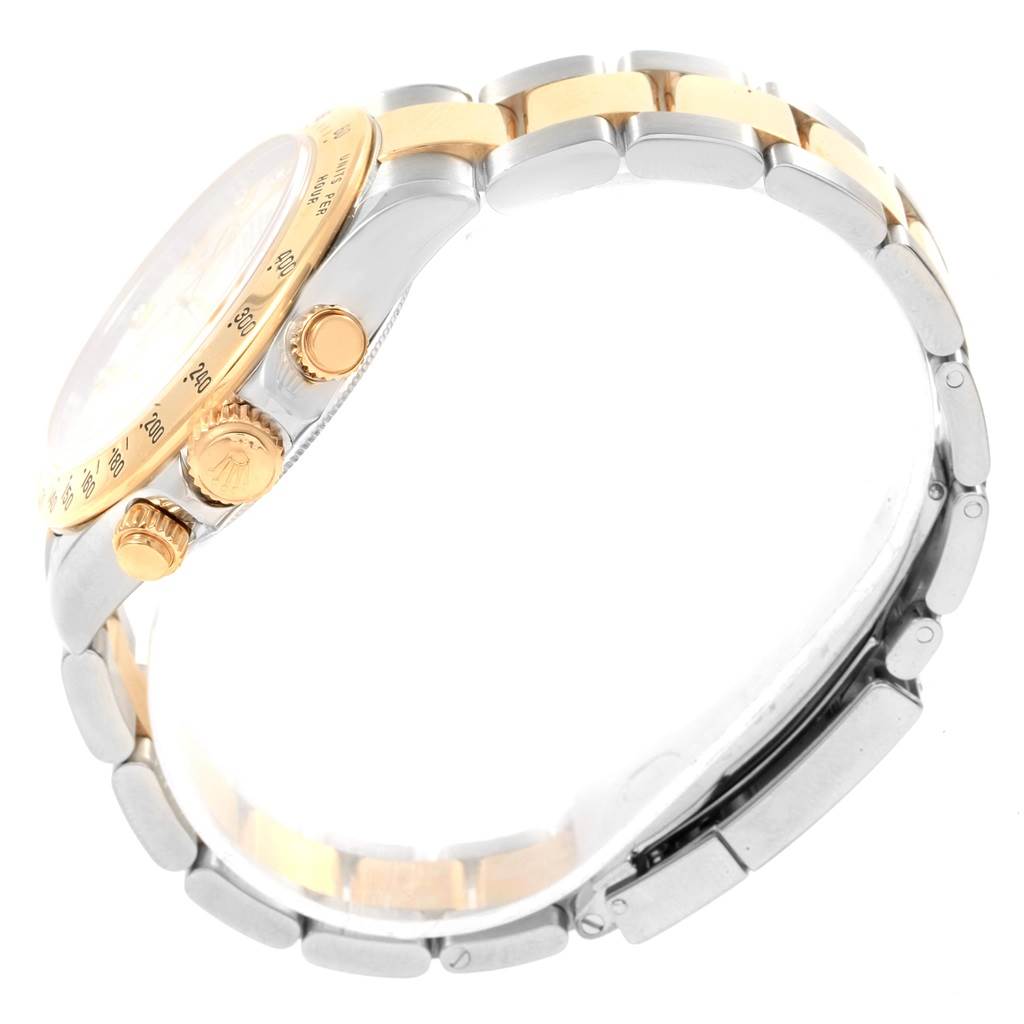 The image shows the side view of a Rolex Daytona 116523 Men
s Steel and Gold (two tone) Mother of Pearl Dial 116523 Men
s Steel and Gold (two tone) Mother of Pearl Dial watch, highlighting the crown, pushers, and part of the bracelet.