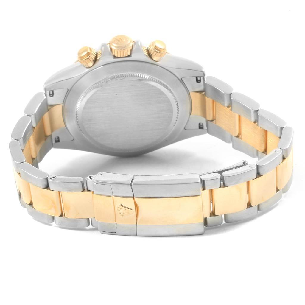 This image shows the back of the Rolex Daytona 116523 Men
s Steel and Gold (two tone) Mother of Pearl Dial 116523 Men
s Steel and Gold (two tone) Mother of Pearl Dial watch and the two-tone bracelet from a slightly elevated angle.