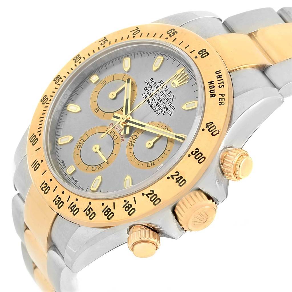 The Rolex Daytona 116523 Men's Steel and Gold (two tone) Grey Dial 116523 Men's Steel and Gold (two tone) Grey Dial watch is shown at an angle highlighting the face, bezel, pushers, and crown.