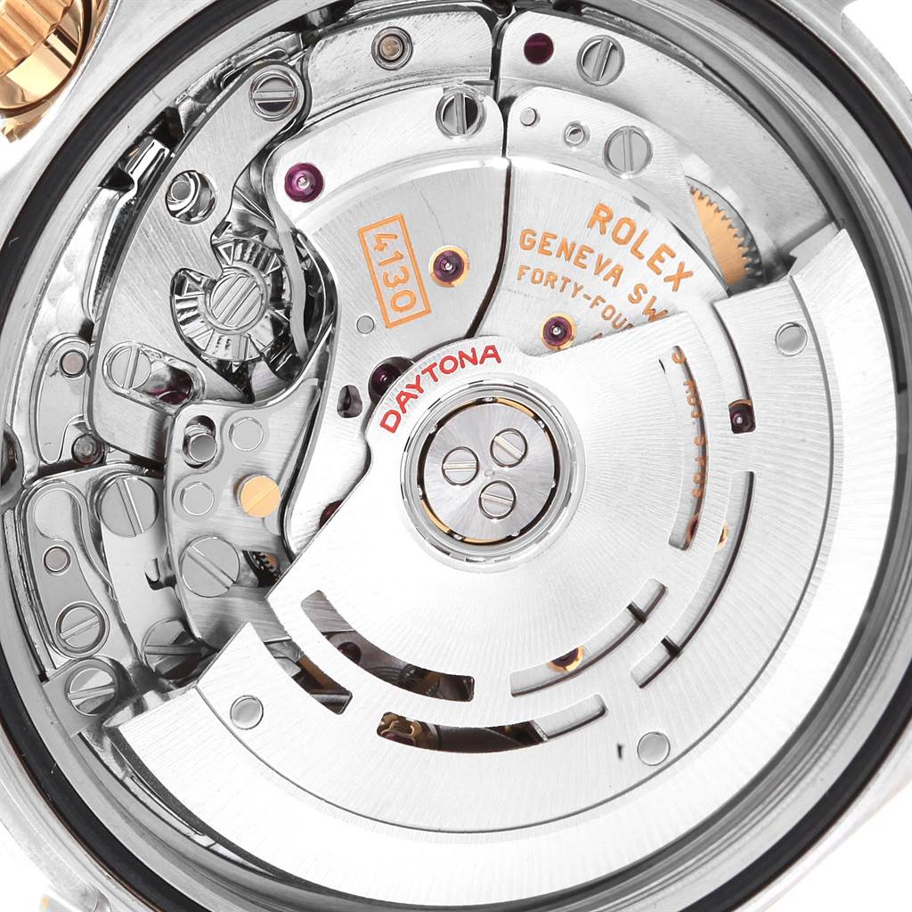 The image shows the intricate movement and internal mechanics of the Rolex Daytona 116523 Men's Steel and Gold (two tone) Grey Dial 116523 Men's Steel and Gold (two tone) Grey Dial watch.