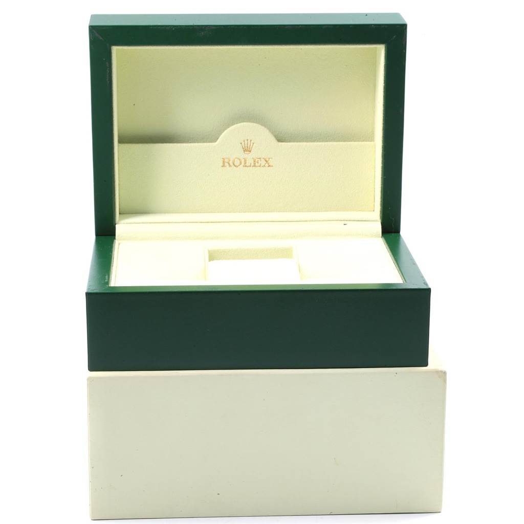This image shows an open green and beige Rolex watch box, likely for the Daytona model.