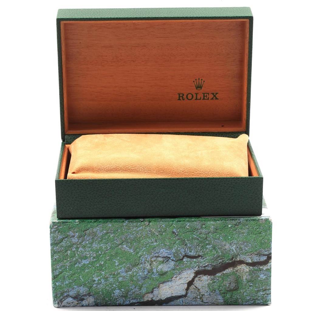 The image shows an open Rolex box with cushioning, typically used for storing the Daytona model.