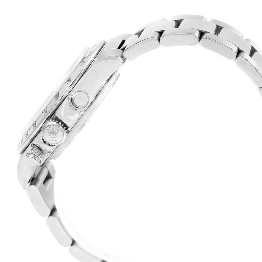 This is a side view angle of a Rolex Daytona 16520 Men's Stainless Steel White Dial 16520 Men's Stainless Steel White Dial watch showing the crown, pushers, and part of the bracelet.