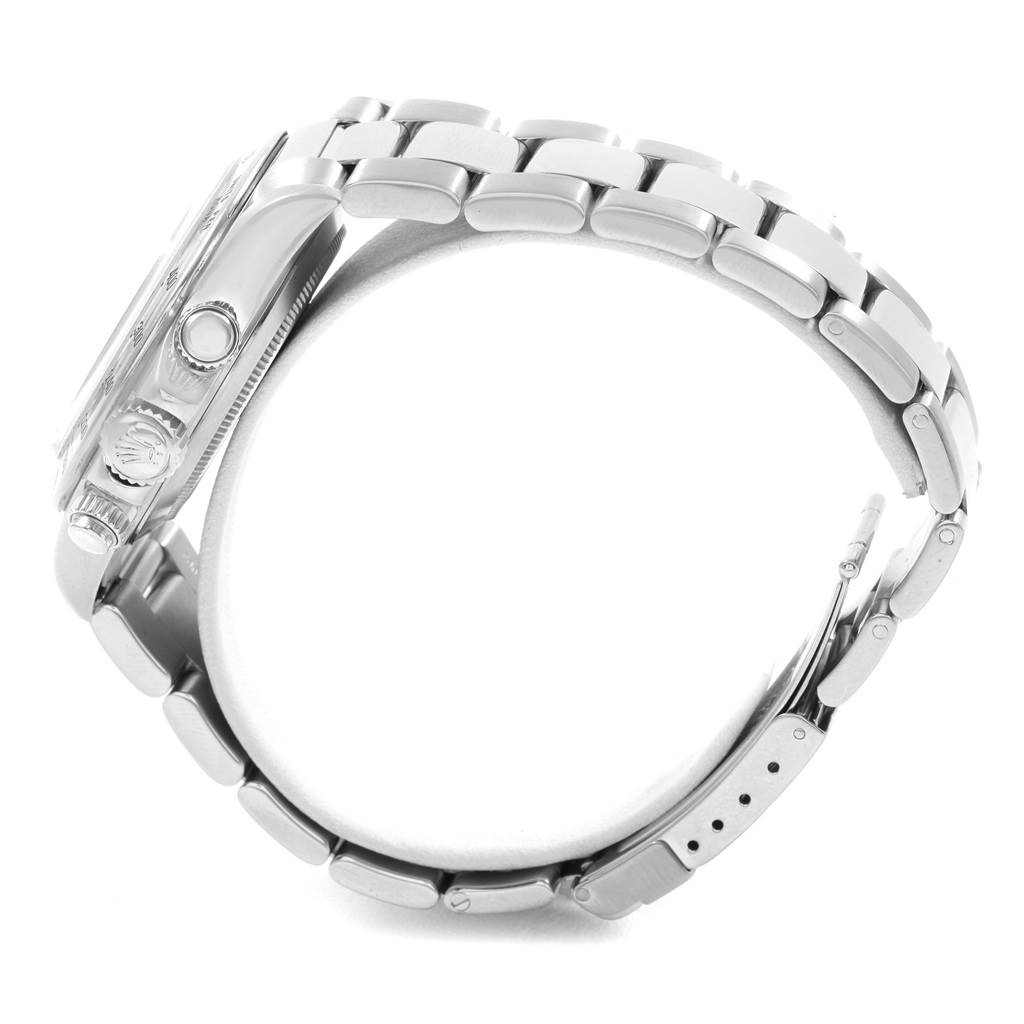 The side profile of the Rolex Daytona 16520 Men's Stainless Steel Black Dial 16520 Men's Stainless Steel Black Dial watch shows the case, crown, push buttons, and a portion of the bracelet.