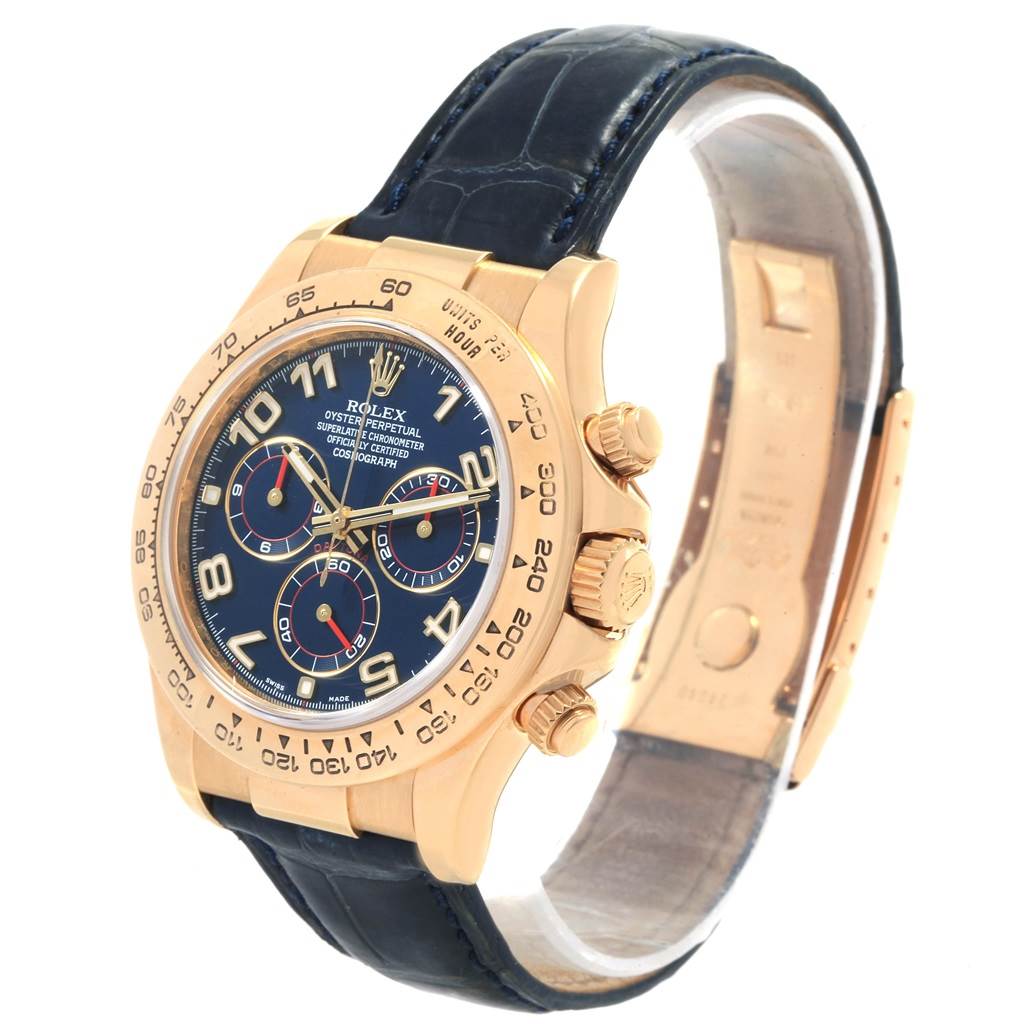The image shows a Rolex Daytona 116518 Men's Yellow Gold Blue Dial 116518 Men's Yellow Gold Blue Dial watch from an angled side view, highlighting the face, bezel, crown, and black leather strap.