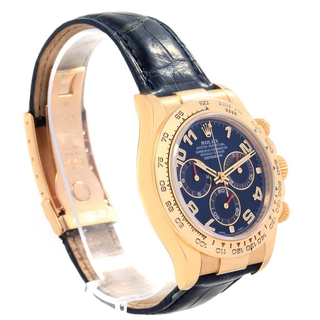 This Rolex Daytona 116518 Men's Yellow Gold Blue Dial 116518 Men's Yellow Gold Blue Dial watch is shown from a side angle, displaying its dial, case, bezel, and leather strap.