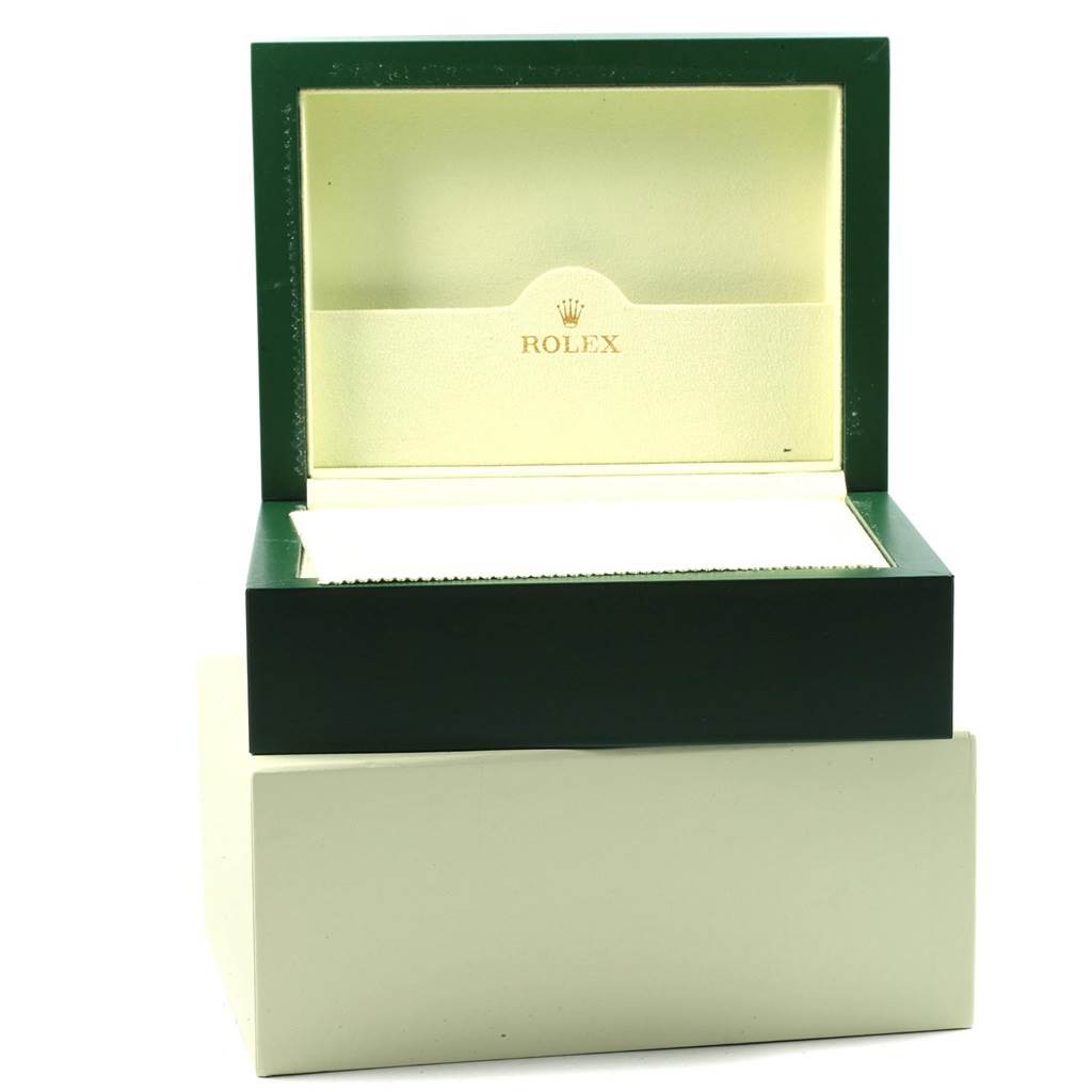 The image shows an empty green and cream Rolex Daytona 116518 Men's Yellow Gold Blue Dial 116518 Men's Yellow Gold Blue Dial watch box with the lid open, viewed from the front.