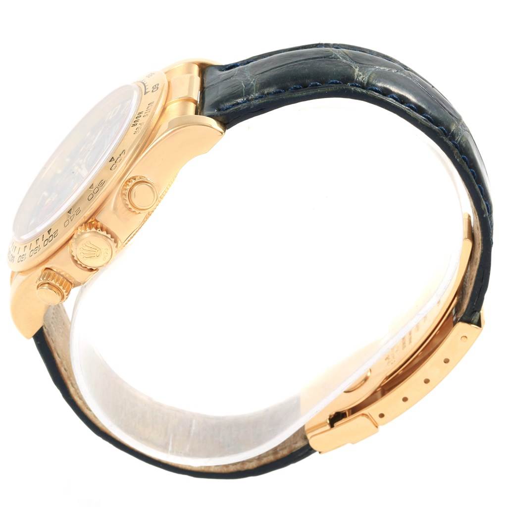 This image shows a side view of a Rolex Daytona 116518 Men's Yellow Gold Blue Dial 116518 Men's Yellow Gold Blue Dial watch, highlighting the case, crown, pushers, and leather strap with the clasp.