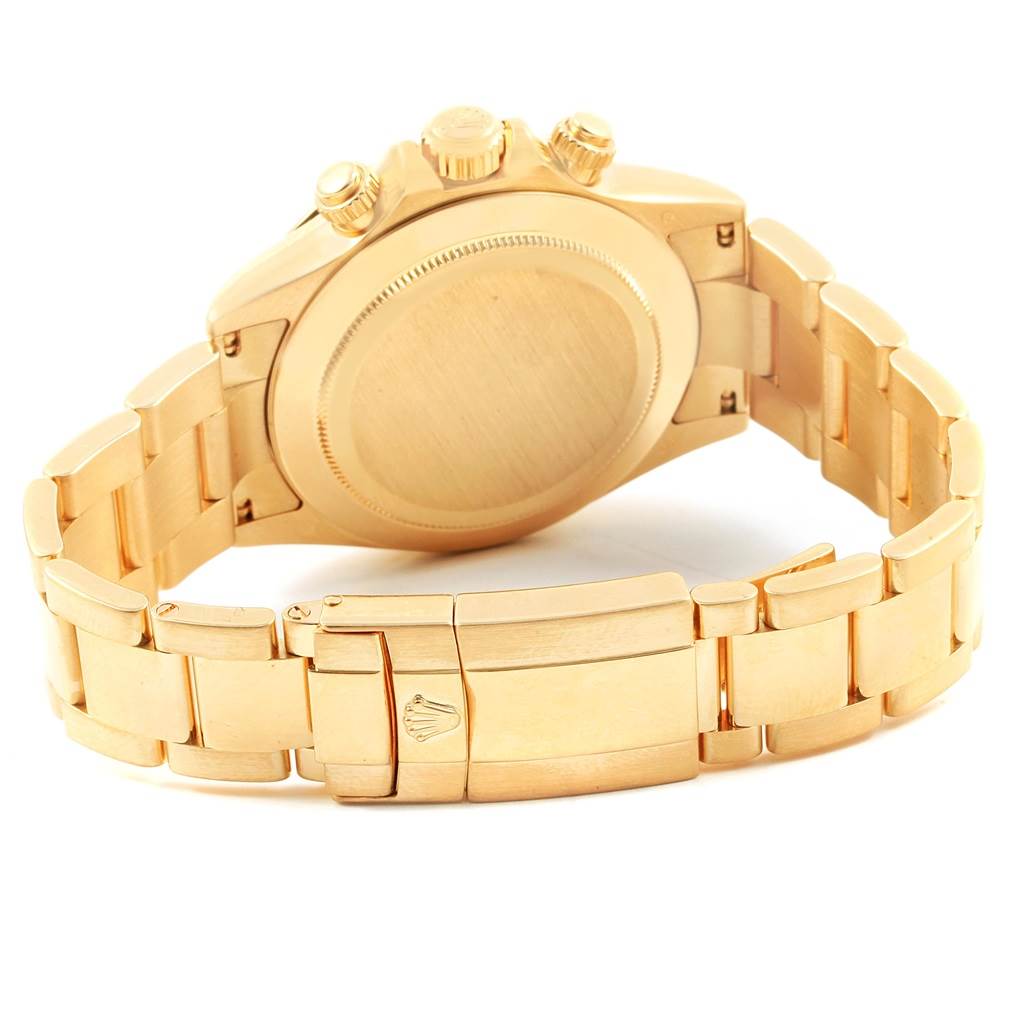 The image shows the rear view of a Rolex Daytona 116528 Men's Yellow Gold Black Dial 116528 Men's Yellow Gold Black Dial watch, highlighting the case back and bracelet clasp.